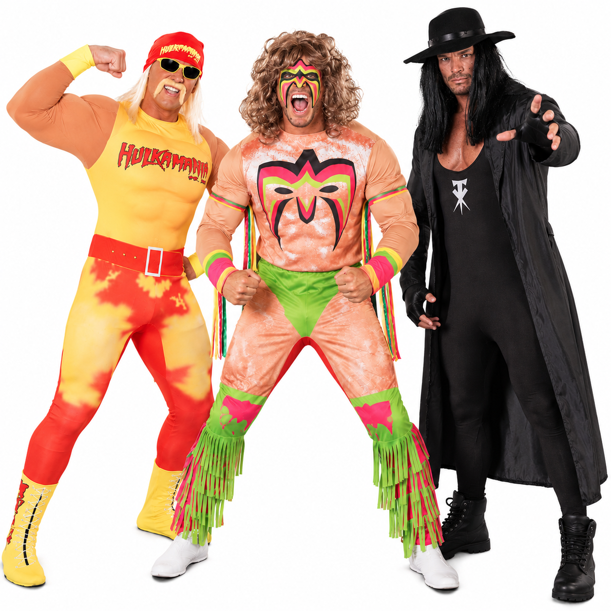 Three friends in exaggerated wrestling-persona costumes with padded muscles, face paint and a cloak and hat