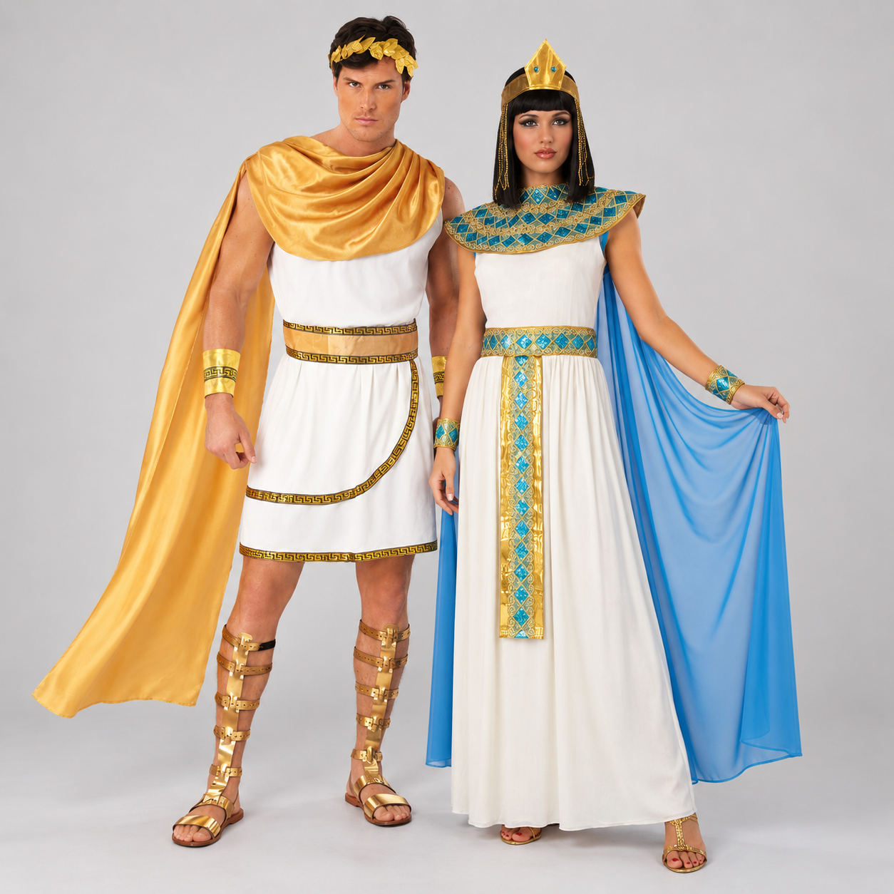 A couple in matching Roman god and Egyptian Cleopatra costumes, gold accessories