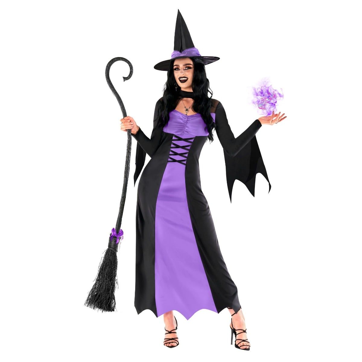 Woman in a black and purple wicked witch gown with laced bodice, bat-wing sleeves, pointed hat and broomstick