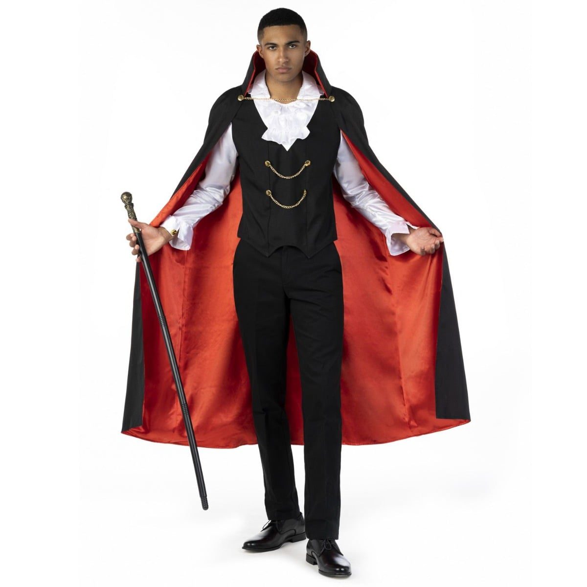 Mens Cool Dracula costume, a black cape with an authentic collar and red lining worn over a black waistcoat with an attached ruffled shirt front, holding a cane