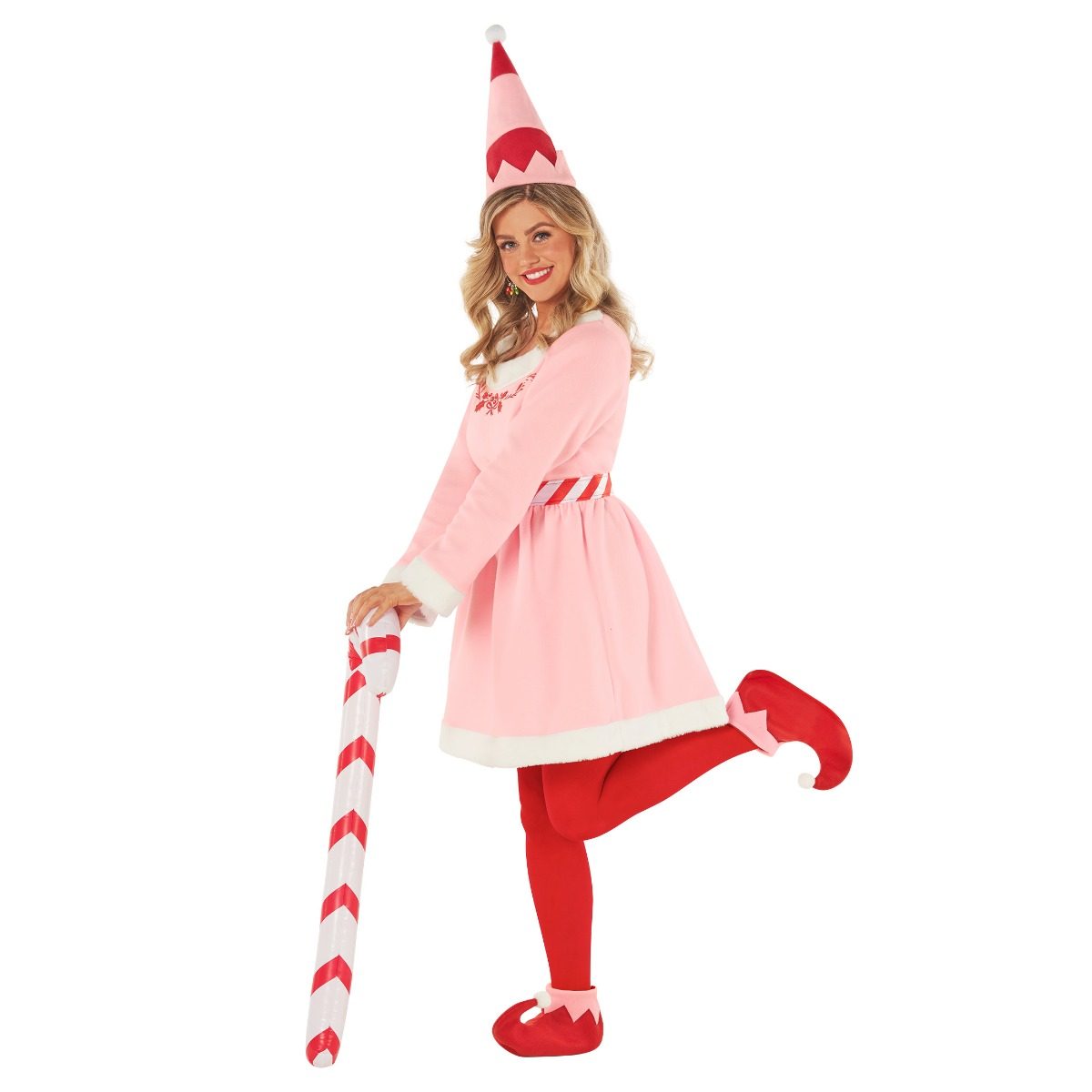 Womens Pink Christmas Elf Costume: pale pink long-sleeved skater dress with white faux fur at the neckline, cuffs, and hem, a red and white striped belt, a pink cone hat with a white pom-pom, red tights, and red curled-toe boot covers