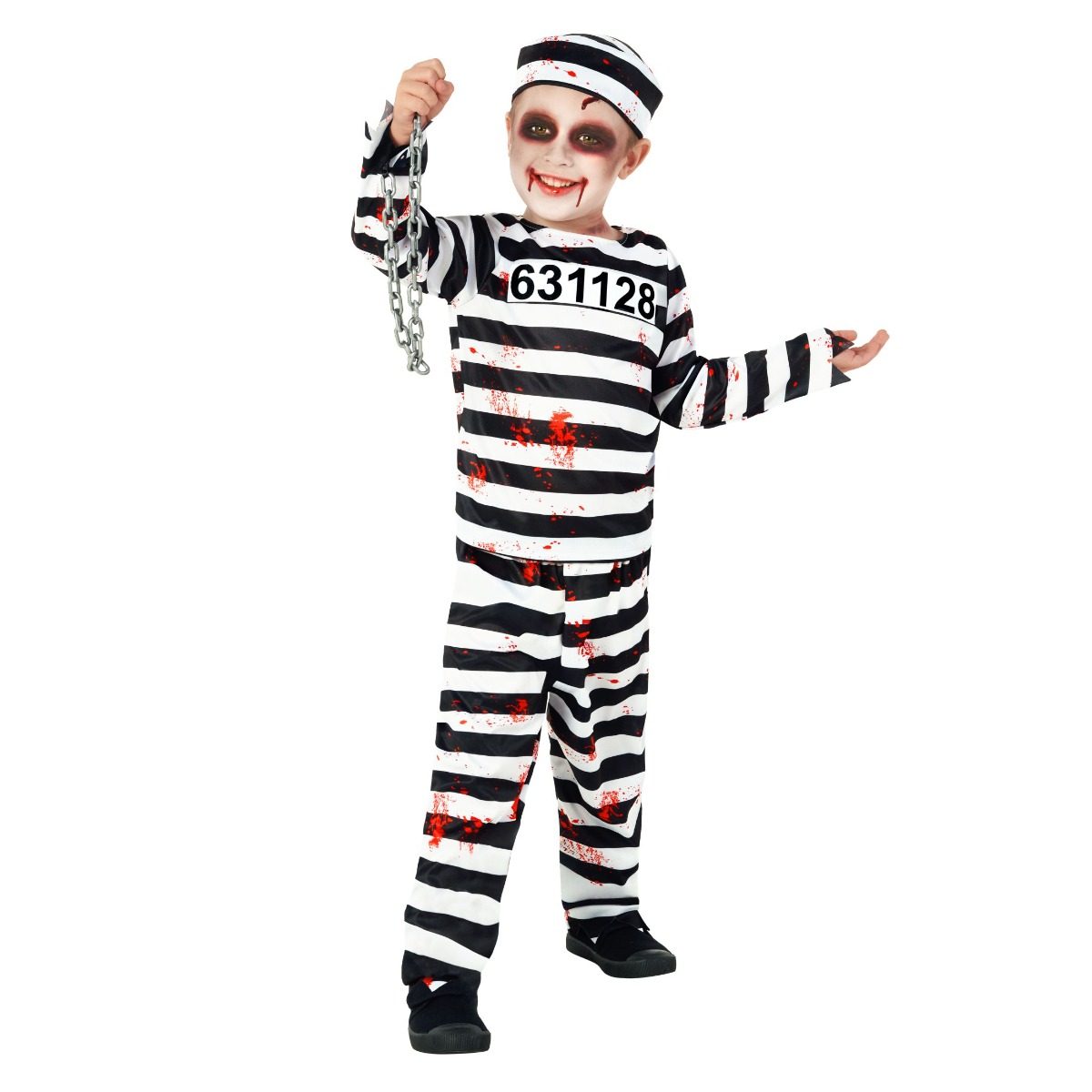 Kids Zombie Prisoner Costume with a black and white striped top and trousers, matching striped hat, printed red spatter, and a grey plastic wrist chain, worn by a smiling boy
