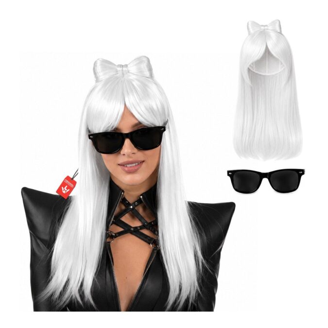 Woman wearing a long, straight white-blonde pop diva wig with a fringe and a bow styled from the hair, with black sunglasses