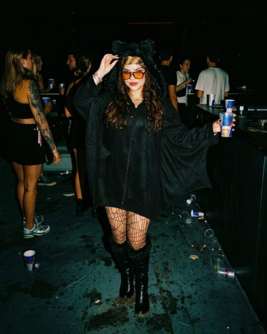 Women's Fluffy Bat Dress Costume worn by a model, lifestyle photo