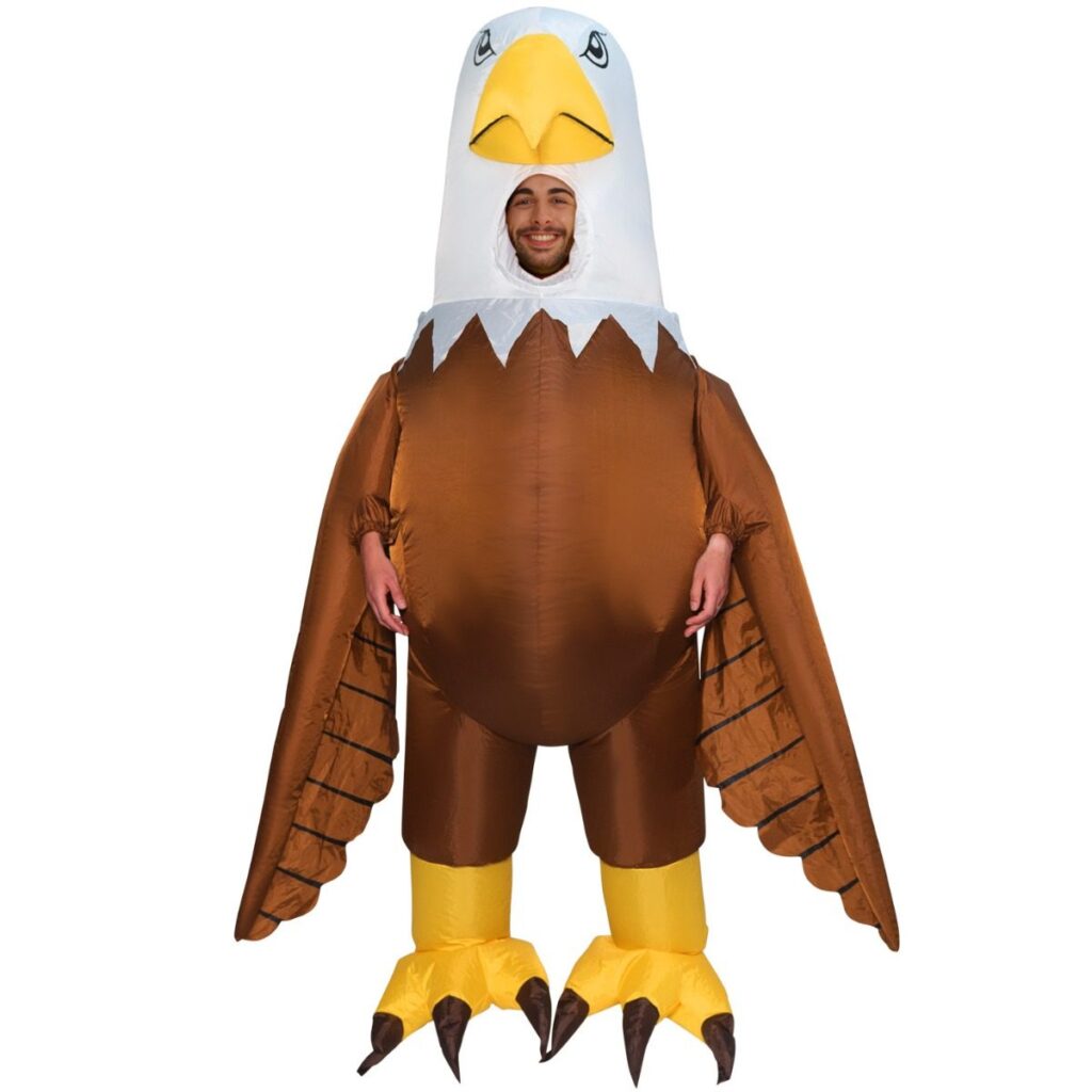Person in a giant inflatable bald eagle costume with brown body and wings, white head with open face, yellow beak and yellow taloned feet