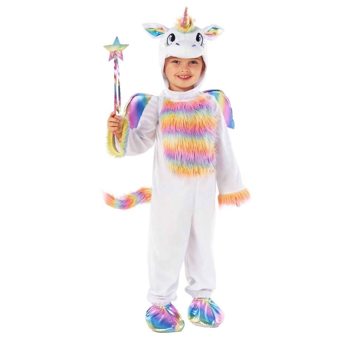 Girl in a white unicorn onesie with a hood carrying a rainbow horn and ears, a rainbow furred chest panel, rainbow foot covers, holding a star-topped wand