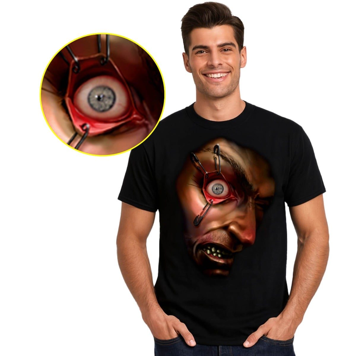 A black t-shirt printed with a distressed human face and a bulging eye held open by pin-like fasteners at chest height, with a close-up circle showing the eye's grey iris in detail
