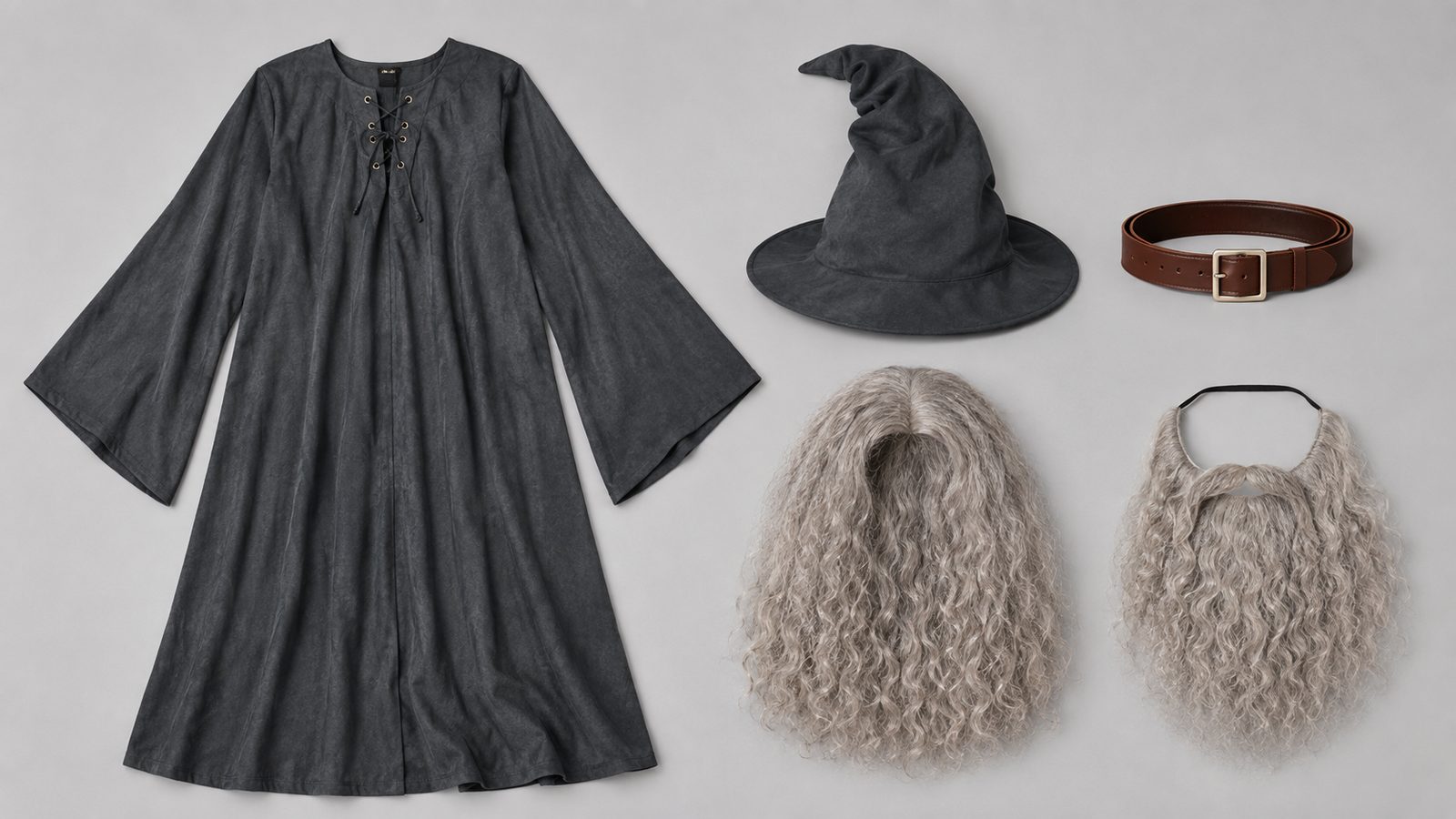 Flat-lay of a gray robe, wide-brimmed hat, brown belt, curly wig and beard laid out on a plain surface