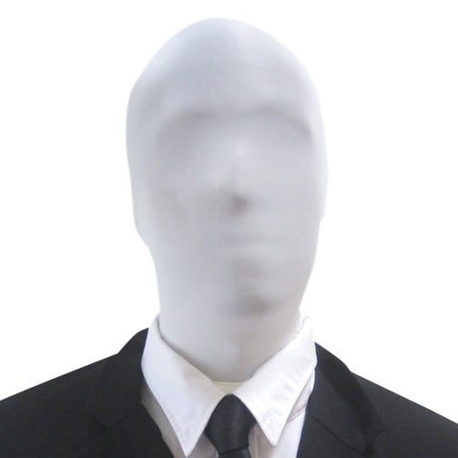 Person wearing a plain white full-face fabric MorphMask covering the entire head, with a black suit, white shirt, and dark tie