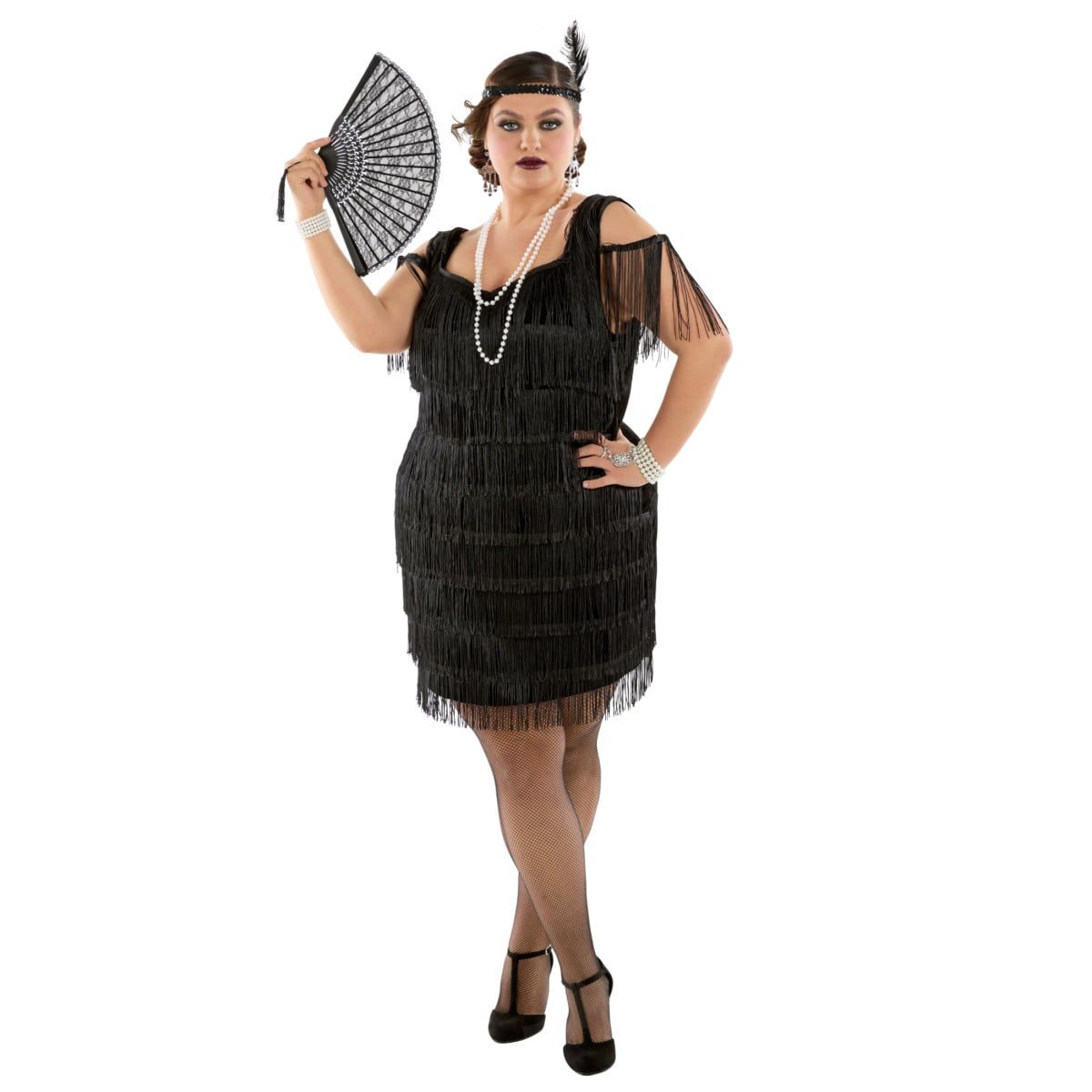 Plus-size model wearing a black fringed 1920s flapper dress costume with a feathered headband and a lace fan