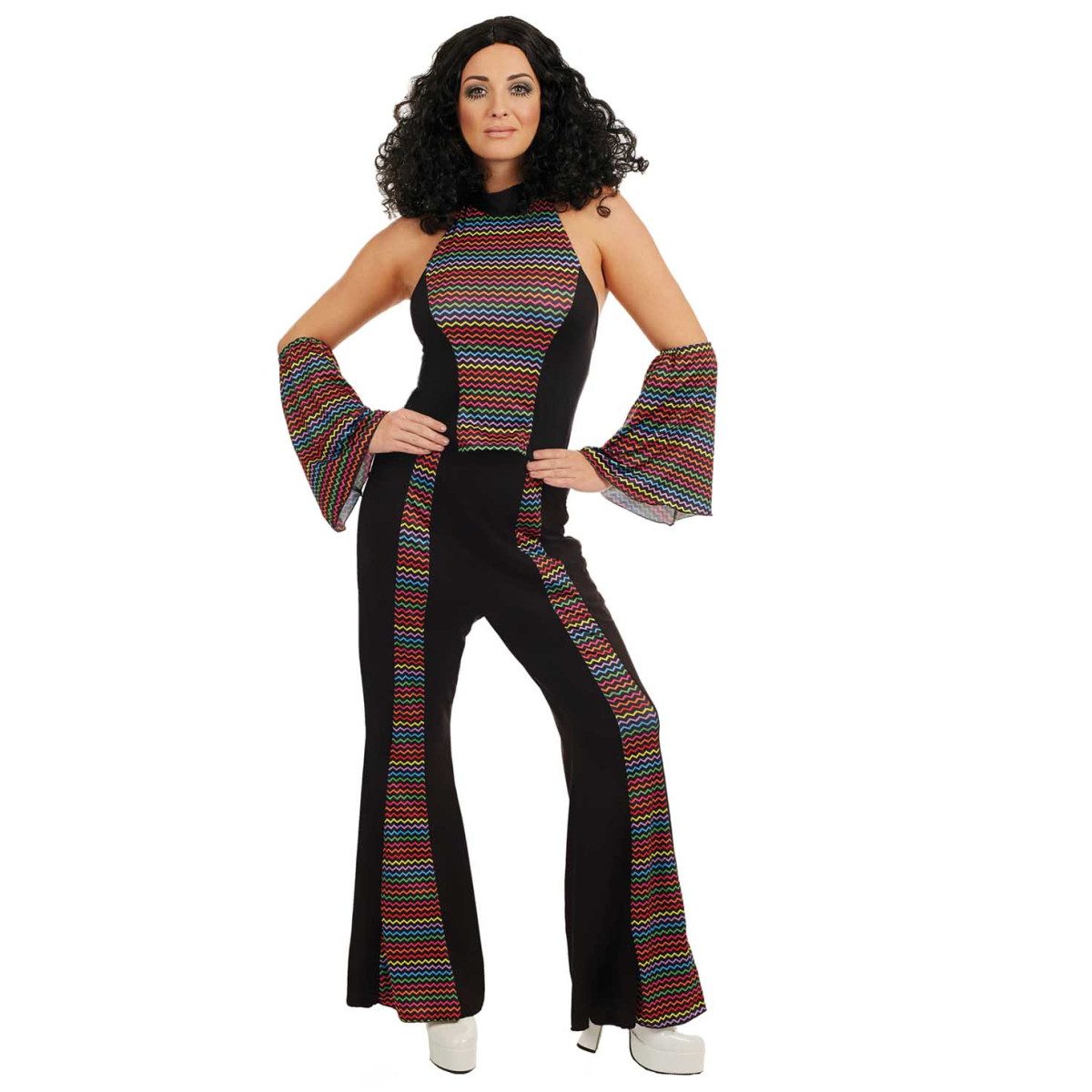 Woman in a black costume with a rainbow zigzag striped panel and flared pant legs, worn as a disco outfit