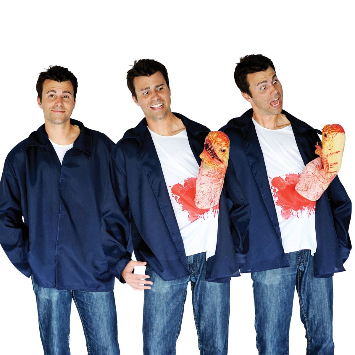 Man wearing a navy zip jacket over a white t-shirt with a tan alien creature puppet bursting through a bloodied tear at chest height