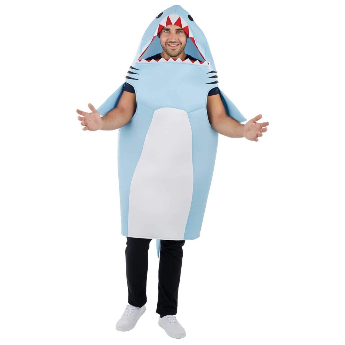 Man in a light blue all-in-one shark costume onesie, standing and moving freely without an inflatable suit