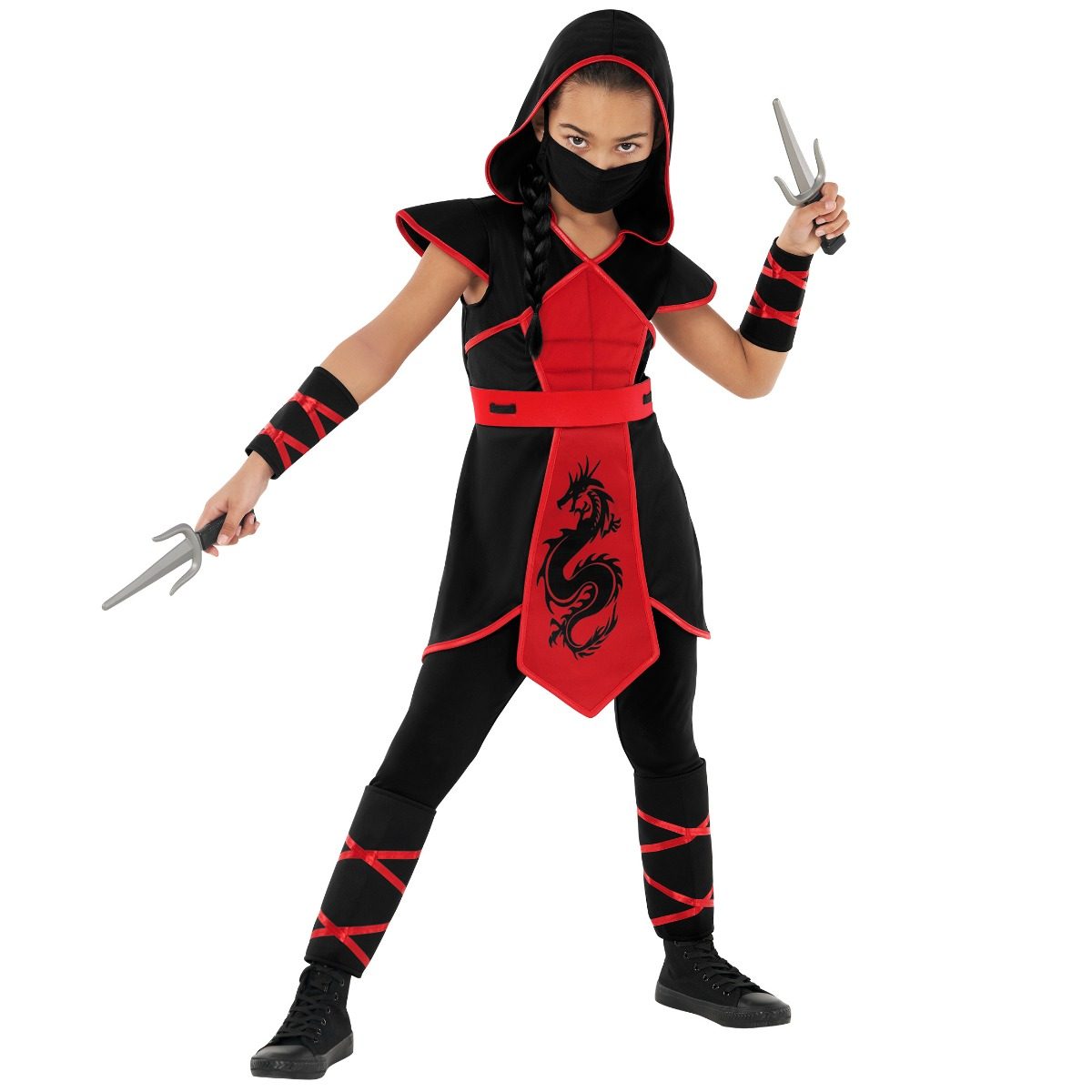 Child in a black and red dragon ninja costume with hand-printed dragon design, hood, face mask and toy daggers
