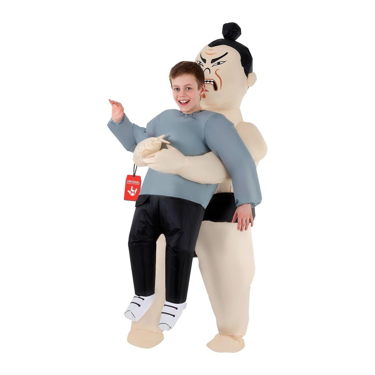Smiling child in the Kids Sumo Pick me Up inflatable costume, an inflatable sumo wrestler with a black topknot and black belt appearing to carry the child, who shows a gray top and black pants