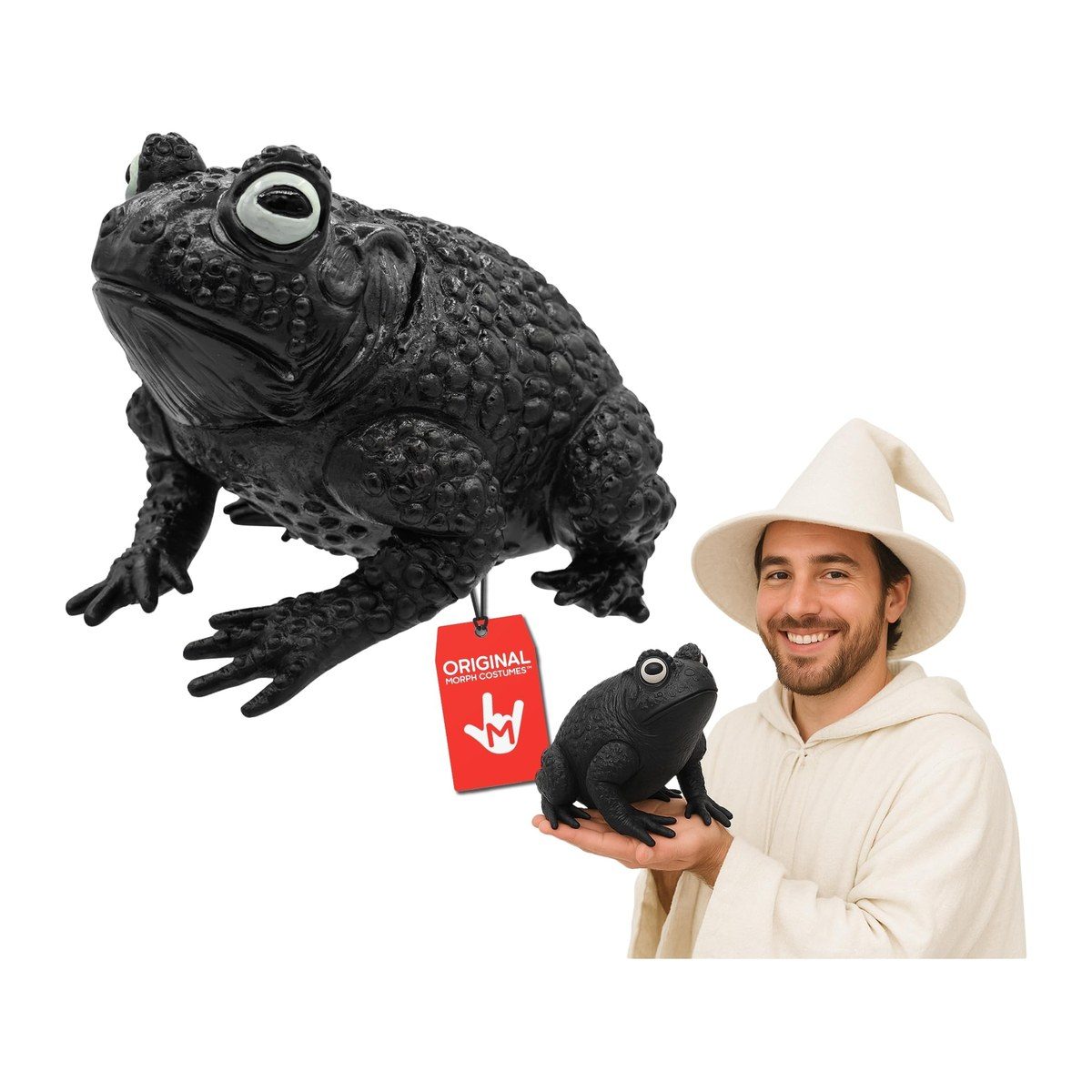 Large black rubber toad prop with a warty textured back and pale bulging eyes, shown alone and held in one hand by a man in a cream wizard hat and robe
