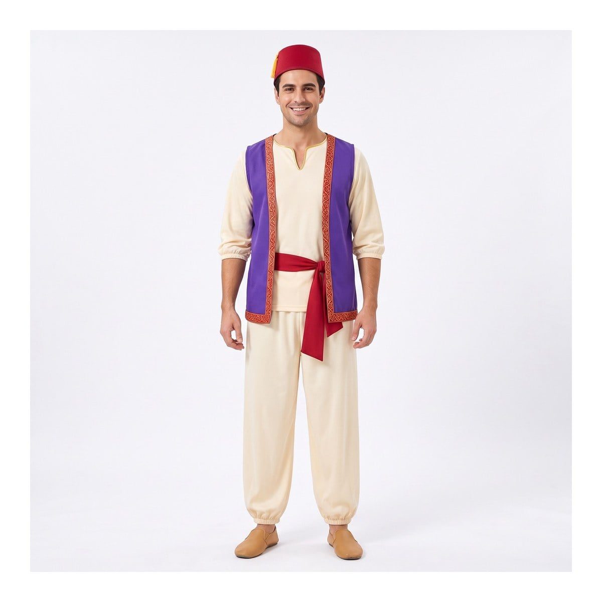 Man in a cream long-sleeve tunic and loose cream pants with a purple vest trimmed in gold, a red waist sash, and a red hat