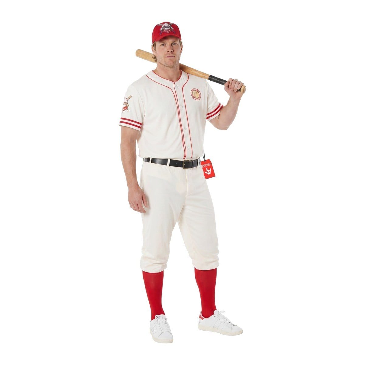 Man in an off-white button-front baseball jersey with red piping and red sleeve stripes, off-white baseball pants gathered at the knee, a black belt, a red cap, long red socks, and white sneakers, resting a wooden bat on his shoulder