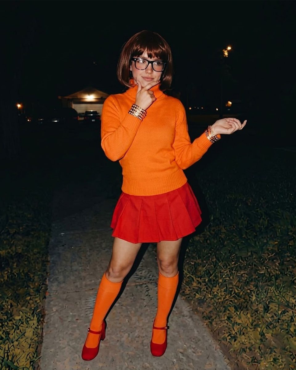 Women's Orange Cartoon Mystery Geek Girl Costume worn by a model, lifestyle photo